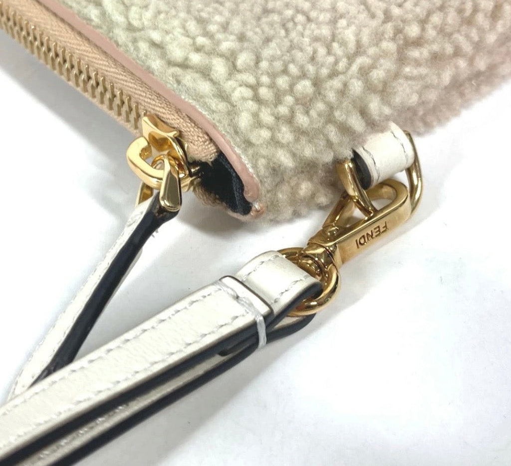 Fendi Mouton Logo Boa Clutch Pouch Beige Shearling – Previously Owned Authentic