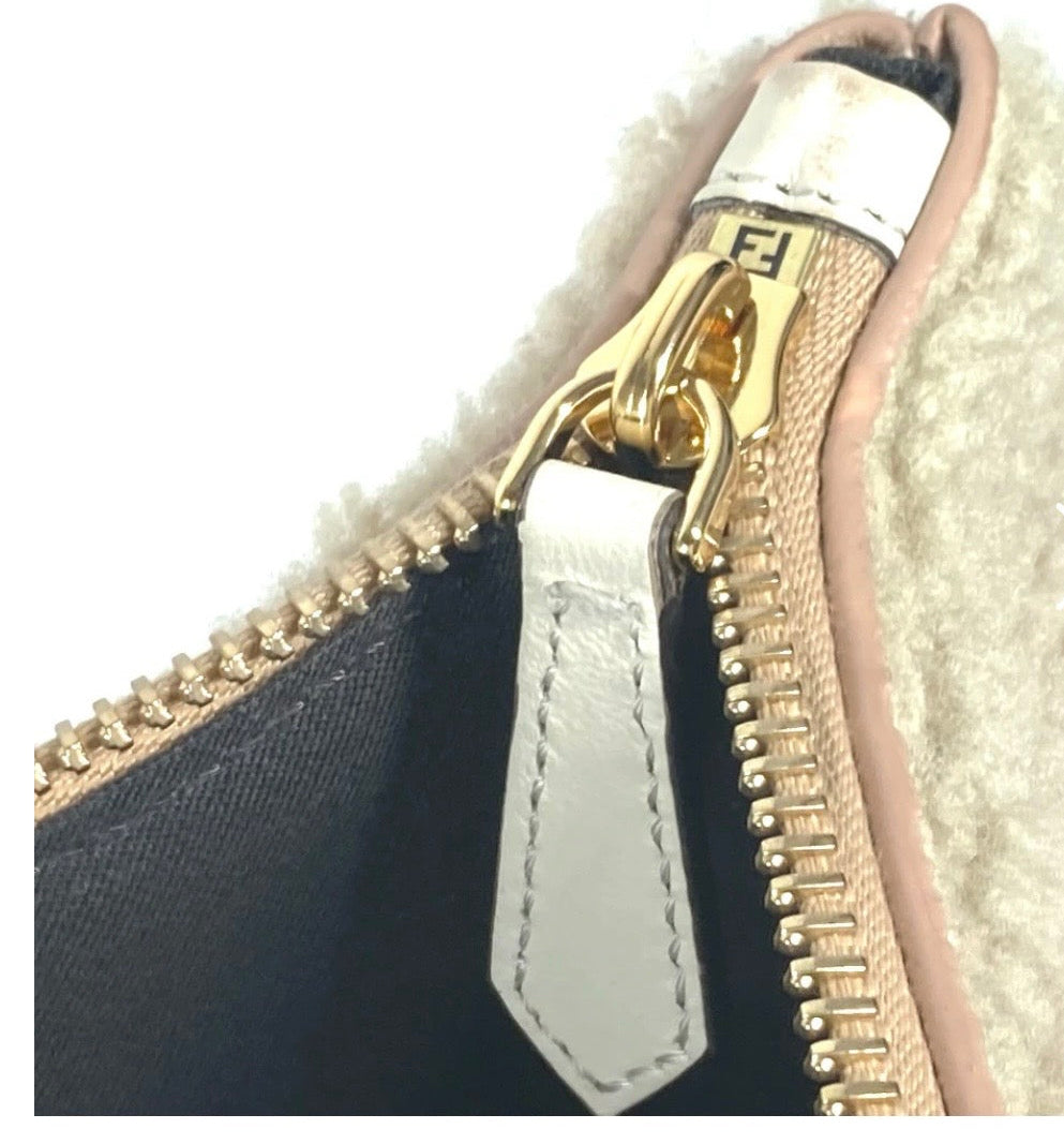 Fendi Mouton Logo Boa Clutch Pouch Beige Shearling – Previously Owned Authentic