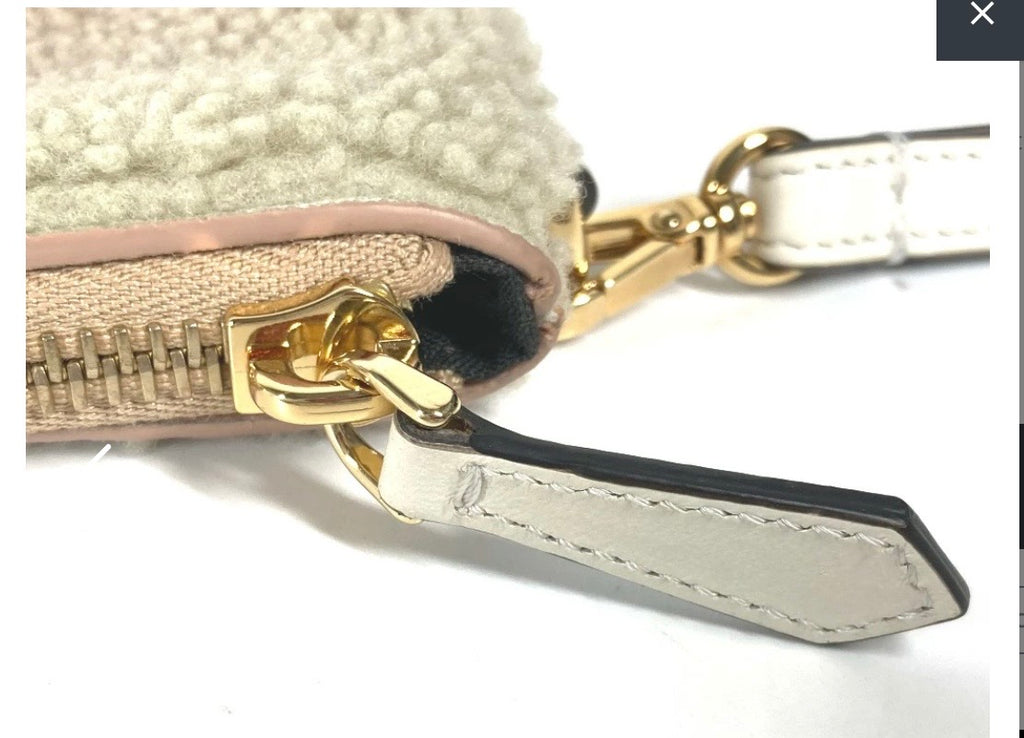 Fendi Mouton Logo Boa Clutch Pouch Beige Shearling – Previously Owned Authentic